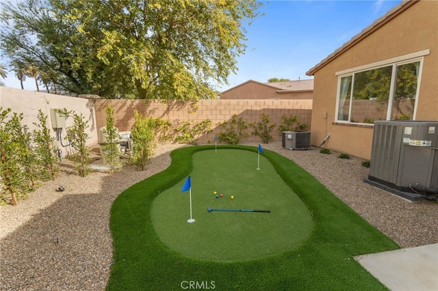 84020 Colibri Ct, Indio, CA 92203 - fenced backyard with cooling unit and a putting green