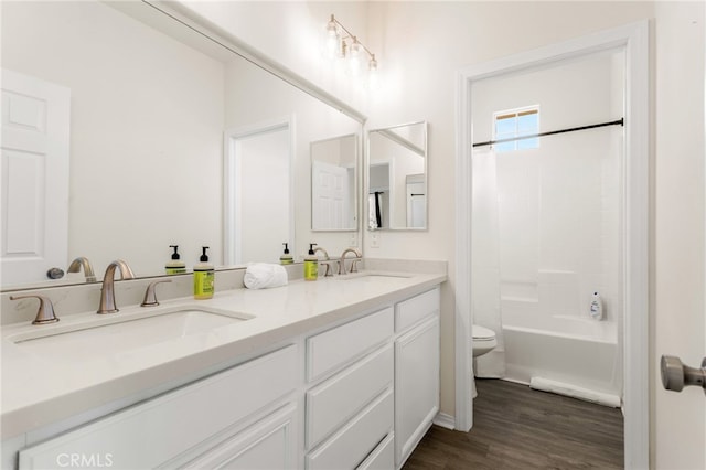 84020 Colibri Ct, Indio, CA 92203 - bathroom with toilet, wood finished floors, double vanity, and shower / bath combination with curtain