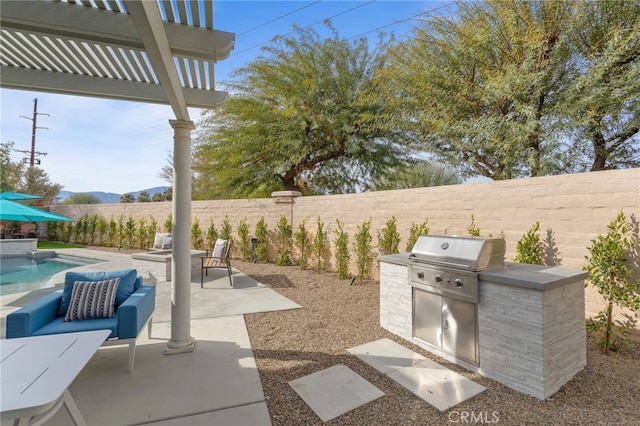 84020 Colibri Ct, Indio, CA 92203 - fenced backyard with a pergola, a patio, and a mountain view