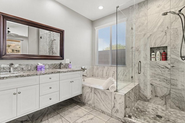 84250 Tramonto Way, Indio, CA 92203 - bathroom with a stall shower, double vanity, a garden tub, and marble finish flooring