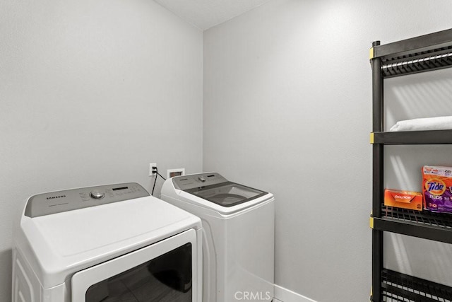 84250 Tramonto Way, Indio, CA 92203 - washroom featuring separate washer and dryer and baseboards