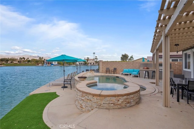 84250 Tramonto Way, Indio, CA 92203 - view of swimming pool featuring a patio, an in-ground hot tub, a pergola, and a water view