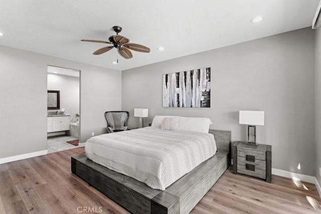 84250 Tramonto Way, Indio, CA 92203 - bedroom with light wood finished floors, baseboards, recessed lighting, ensuite bath, and a ceiling fan