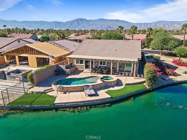 84250 Tramonto Way, Indio, CA 92203 - view of pool with a patio, a pool with connected hot tub, and a water and mountain view