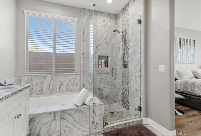 84250 Tramonto Way, Indio, CA 92203 - full bathroom featuring a marble finish shower, a garden tub, ensuite bathroom, and vanity