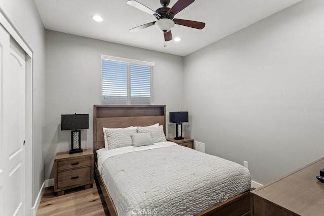 84250 Tramonto Way, Indio, CA 92203 - bedroom with light wood-style flooring, recessed lighting, a closet, baseboards, and ceiling fan