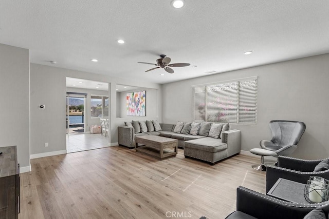 84250 Tramonto Way, Indio, CA 92203 - living room with ceiling fan, light wood-style flooring, baseboards, and recessed lighting