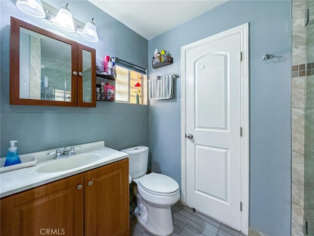 45431 Sancroft Ave, Lancaster, CA 93535 - full bath with vanity, toilet, and tile patterned flooring