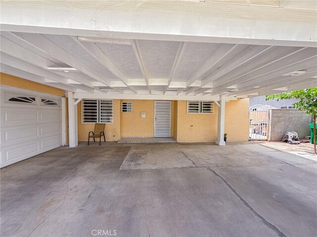 45431 Sancroft Ave, Lancaster, CA 93535 - garage with a carport and a gate