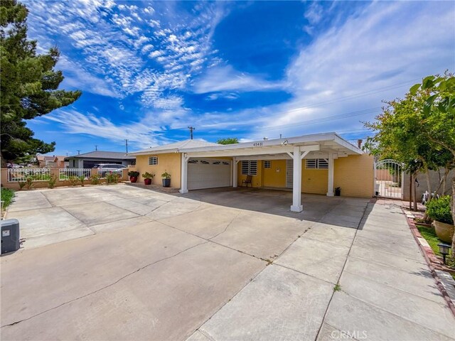 45431 Sancroft Ave, Lancaster, CA 93535 - ranch-style house with a garage, concrete driveway, and a gate