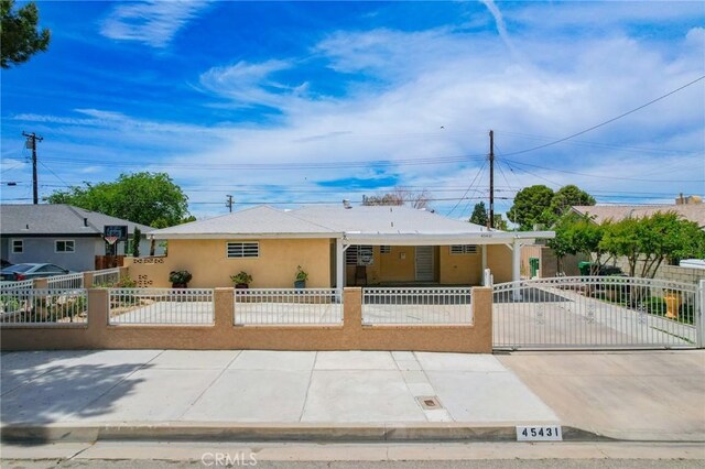 45431 Sancroft Ave, Lancaster, CA 93535 - view of front facade with a fenced front yard, stucco siding, and a gate