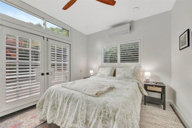 306 Avenida Monterey, San Clemente, CA 92672 - bedroom with a wall mounted AC, multiple windows, baseboards, and french doors