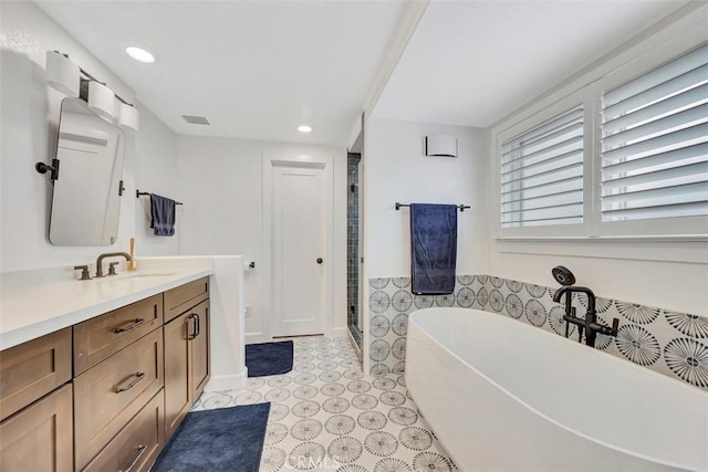 306 Avenida Monterey, San Clemente, CA 92672 - full bathroom with vanity, a freestanding tub, a shower stall, and recessed lighting