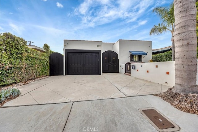 306 Avenida Monterey, San Clemente, CA 92672 - view of front of property with driveway, a gate, an attached garage, and stucco siding