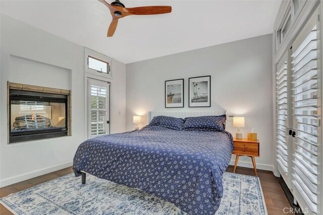 306 Avenida Monterey, San Clemente, CA 92672 - bedroom featuring baseboards, a ceiling fan, wood finished floors, and access to outside