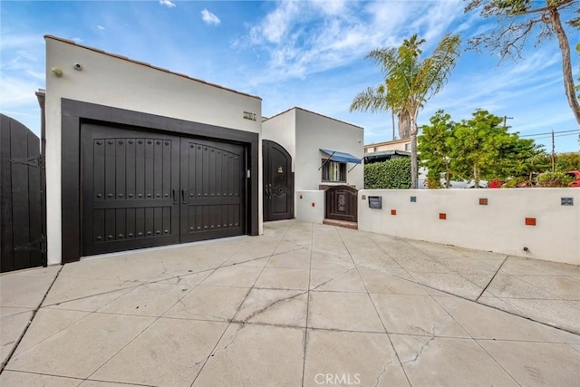 306 Avenida Monterey, San Clemente, CA 92672 - view of front of home with a gate, stucco siding, and concrete driveway