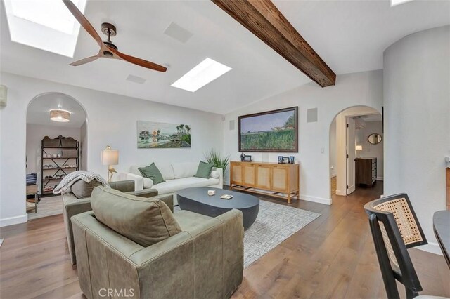 306 Avenida Monterey, San Clemente, CA 92672 - living area with a skylight, arched walkways, wood finished floors, and a ceiling fan
