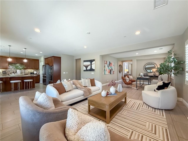 6184 Lafayette St, Chino, CA 91710 - living area featuring recessed lighting, baseboards, and light wood finished floors