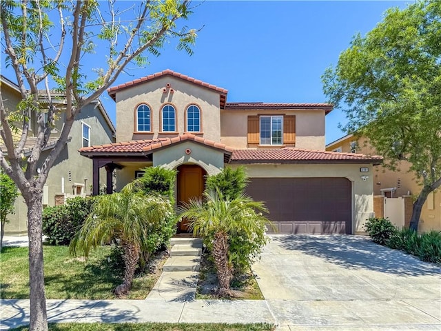 6184 Lafayette St, Chino, CA 91710 - mediterranean / spanish-style home with stucco siding, a tiled roof, a garage, and driveway
