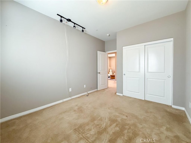 6184 Lafayette St, Chino, CA 91710 - unfurnished bedroom featuring light carpet, baseboards, and a closet
