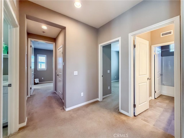 6184 Lafayette St, Chino, CA 91710 - hall with light colored carpet, baseboards, and recessed lighting