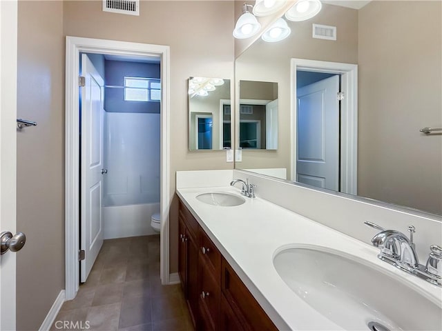 6184 Lafayette St, Chino, CA 91710 - bathroom with double vanity, toilet, baseboards, and washtub / shower combination