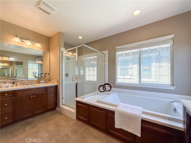6184 Lafayette St, Chino, CA 91710 - bathroom with vanity, a stall shower, a garden tub, and recessed lighting