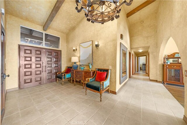 1465 Via Coronel, Palos Verdes Estates, CA 90274 - tiled foyer with high vaulted ceiling, a chandelier, and beam ceiling