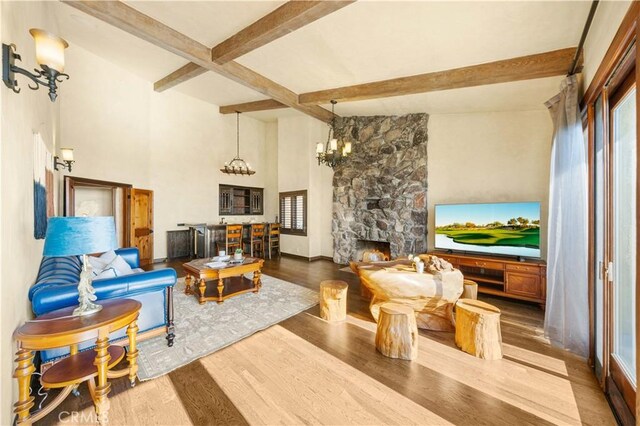 1465 Via Coronel, Palos Verdes Estates, CA 90274 - living area with wood finished floors, healthy amount of natural light, a chandelier, a stone fireplace, and beam ceiling