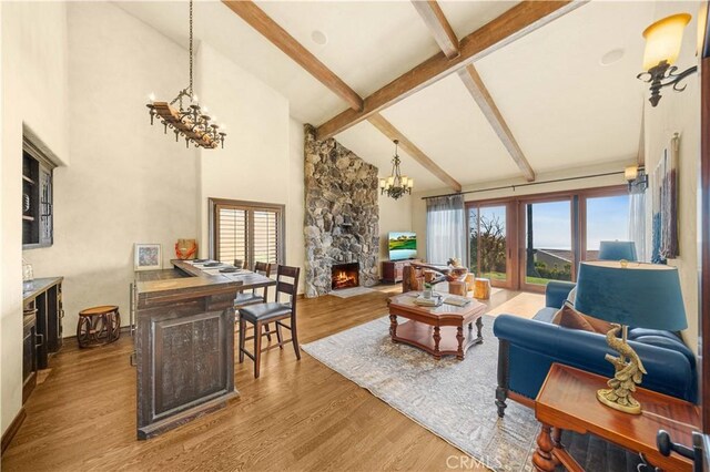 1465 Via Coronel, Palos Verdes Estates, CA 90274 - living room with plenty of natural light, a chandelier, high vaulted ceiling, beamed ceiling, and wood finished floors