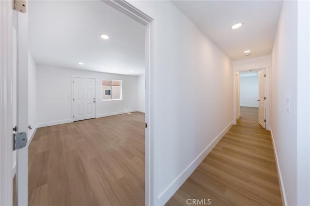 22016 Schoolcraft St, Canoga Park, CA 91303 - corridor featuring light wood finished floors, baseboards, and recessed lighting