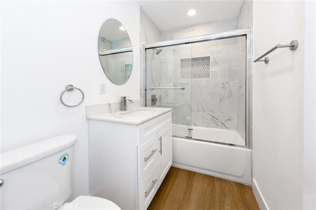 22016 Schoolcraft St, Canoga Park, CA 91303 - full bathroom with toilet, vanity, wood finished floors, enclosed tub / shower combo, and recessed lighting