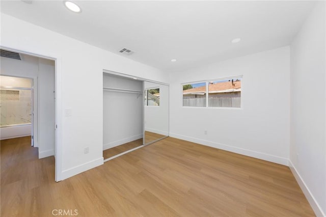 22016 Schoolcraft St, Canoga Park, CA 91303 - unfurnished bedroom with light wood finished floors, a closet, baseboards, and recessed lighting