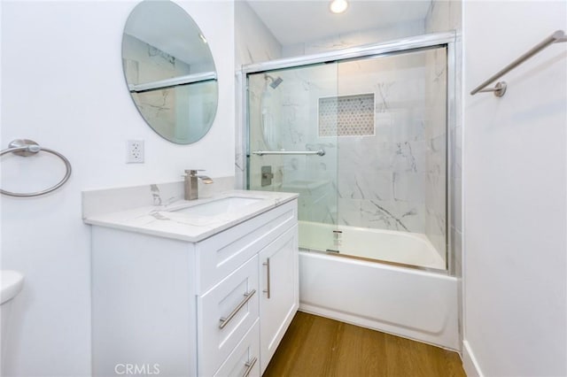 22016 Schoolcraft St, Canoga Park, CA 91303 - bathroom with vanity, wood finished floors, enclosed tub / shower combo, and toilet