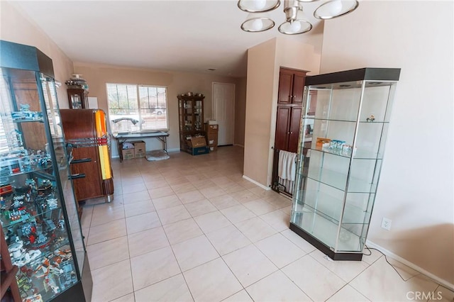 15193 Arcadian St, Adelanto, CA 92301 - bathroom with tile patterned flooring, a chandelier, and baseboards