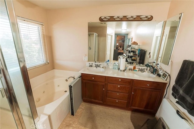15193 Arcadian St, Adelanto, CA 92301 - full bath featuring a stall shower, a whirlpool tub, double vanity, and tile patterned floors