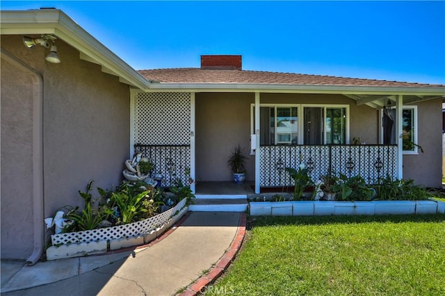 1706 James Pl, Pomona, CA 91767 - property entrance featuring stucco siding, a porch, and a lawn