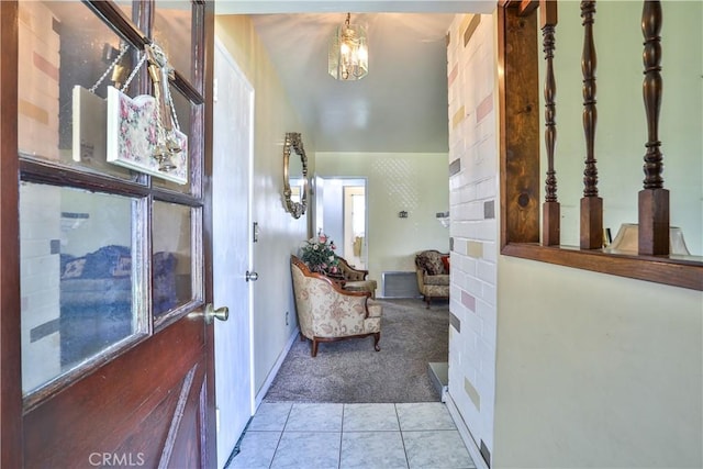 1706 James Pl, Pomona, CA 91767 - hallway featuring carpet flooring, tile patterned flooring, baseboards, and a chandelier