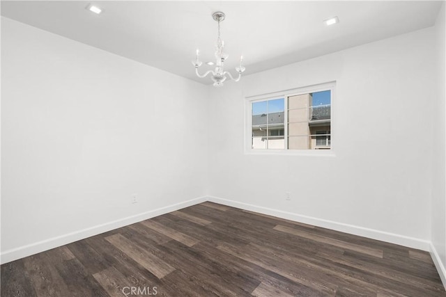 18653 Burbank Blvd Unit 2, Tarzana, CA 91356 - unfurnished room with a chandelier, baseboards, dark wood-type flooring, and recessed lighting