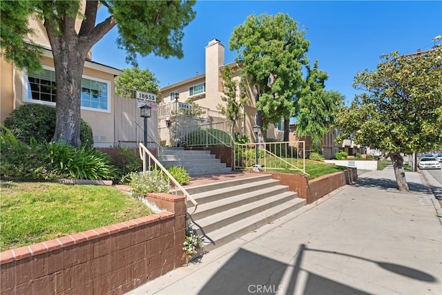 18653 Burbank Blvd Unit 2, Tarzana, CA 91356 - view of front of property with stairway, a front lawn, and a residential view