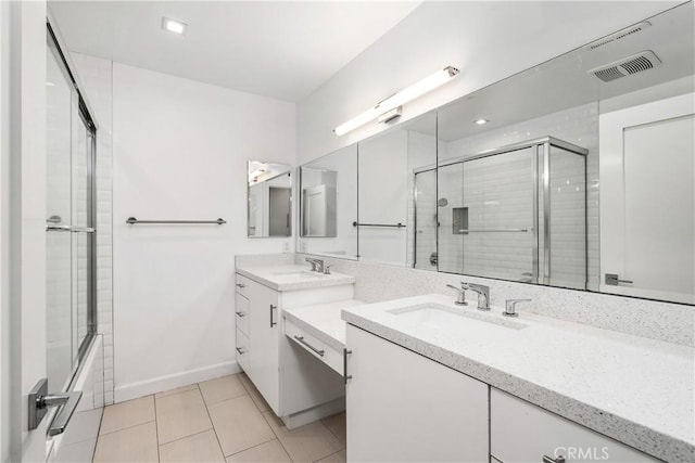 18653 Burbank Blvd Unit 2, Tarzana, CA 91356 - full bath featuring tile patterned floors, baseboards, vanity, and bath / shower combo with glass door