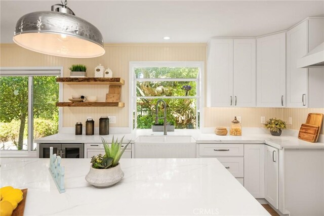 29422 Modjeska Canyon Rd, Modjeska Canyon, CA 92676 - kitchen featuring white cabinets, plenty of natural light, and light stone countertops