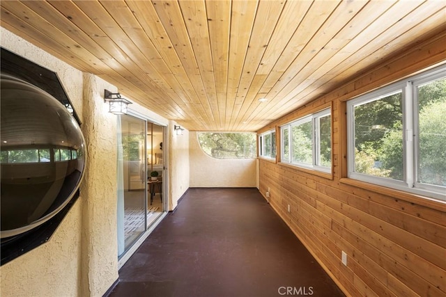 29422 Modjeska Canyon Rd, Modjeska Canyon, CA 92676 - unfurnished sunroom featuring wooden ceiling, healthy amount of natural light, wood walls, and finished concrete floors