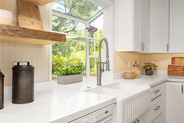 29422 Modjeska Canyon Rd, Modjeska Canyon, CA 92676 - kitchen featuring white cabinetry, light stone counters, white dishwasher, and open shelves