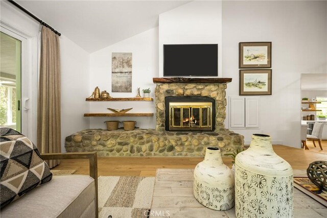 29422 Modjeska Canyon Rd, Modjeska Canyon, CA 92676 - living area featuring vaulted ceiling, wood finished floors, and a stone fireplace