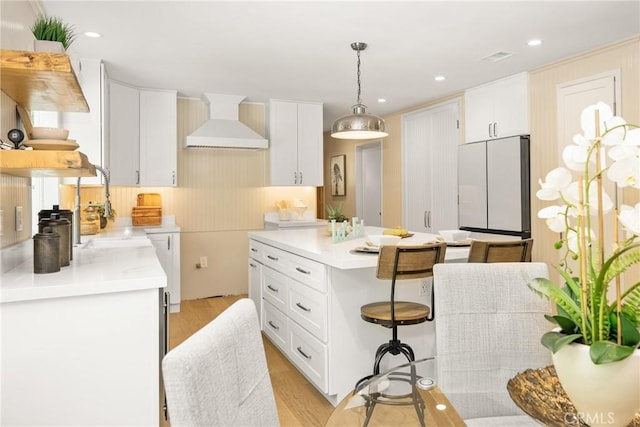 29422 Modjeska Canyon Rd, Modjeska Canyon, CA 92676 - kitchen with custom range hood, freestanding refrigerator, white cabinets, light wood-type flooring, and recessed lighting