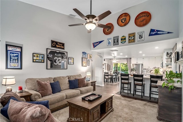 42311 Camden Way, Lancaster, CA 93536 - living room featuring ceiling fan, a high ceiling, and light carpet