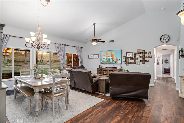 42311 Camden Way, Lancaster, CA 93536 - dining area with a ceiling fan, dark wood-style floors, arched walkways, a chandelier, and high vaulted ceiling
