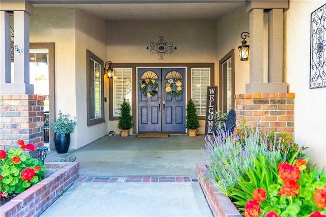 42311 Camden Way, Lancaster, CA 93536 - view of exterior entry featuring stucco siding and a porch