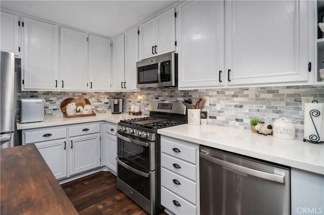 42311 Camden Way, Lancaster, CA 93536 - kitchen featuring stainless steel appliances, light countertops, backsplash, and white cabinetry